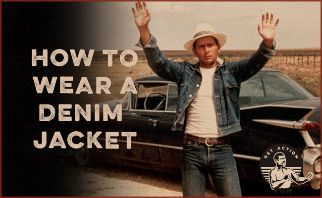 Man raising his hands in denim jacket.