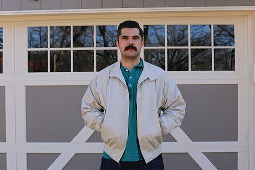 Brett mckay wearing a harrington blouson jacket.