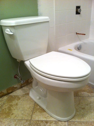 New toilet installed in bathroom. 