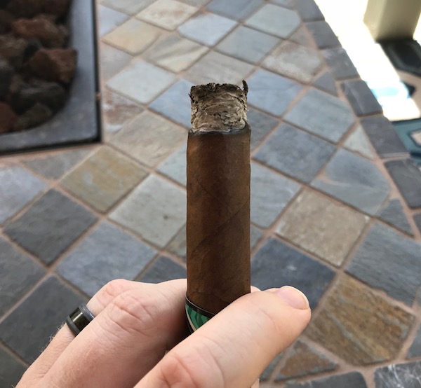 Gray ash on the foot of cigar.