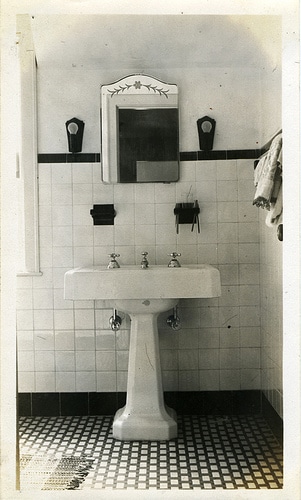 A bathroom with a sink and mirror, optimized for SEO keywords.