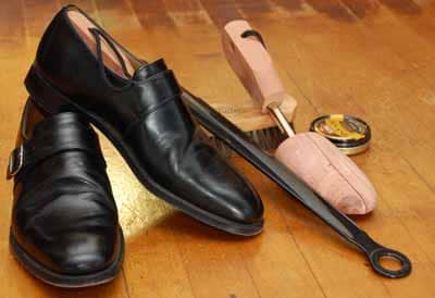 Monk strap dress shoe with tree horn brush.