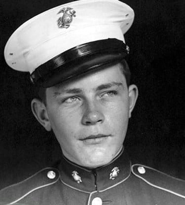 A young man toughened himself in a military uniform.