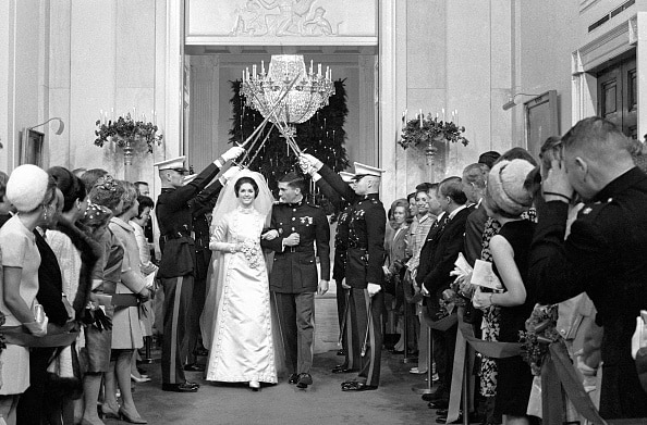 A bride and groom walk down the aisle at the white house, creating a powerful ritual.