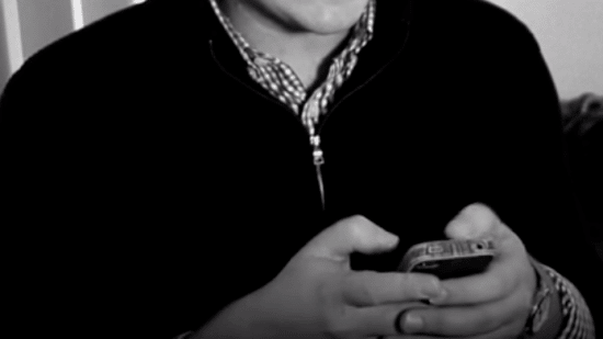 A man holding a cell phone.