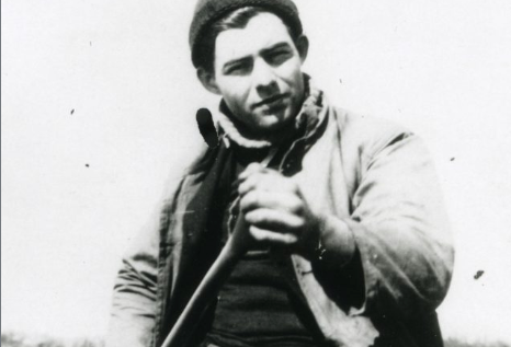 A classic photo of a man with a gun.